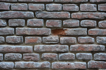 Wall with a broken brick