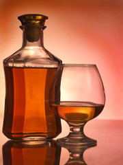 Still life with cognac glass and bottle in box