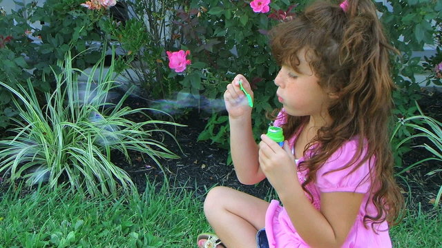 Girl Blowing Bubbles