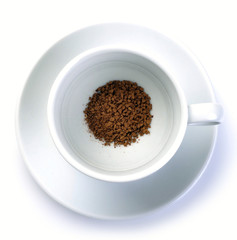 granules of instant coffee in cup