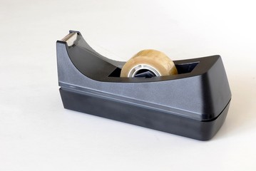 D&eacute;rouleur d'adh&eacute;sif