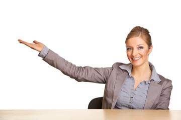 Businesswoman in suit pointing hand isolated on white