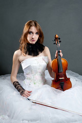 Girl in white dress with violin