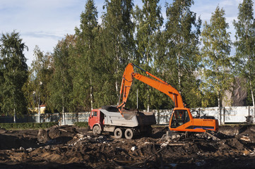 Excavator loading dump-truck