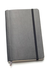 Black Moleskine notebook on white background