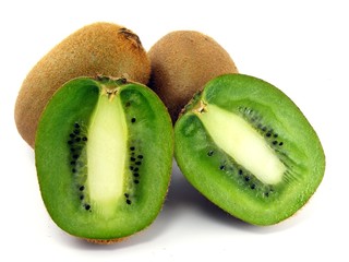 Freshly sliced & whole kiwi fruits on a white background