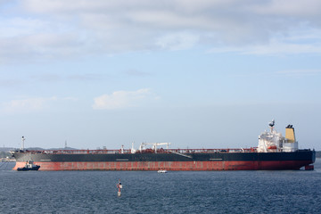 Supertanker ship moored in harbour.