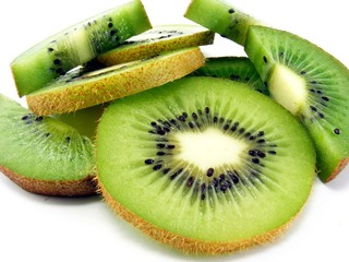 Fresh slices of kiwi fruit on a white background