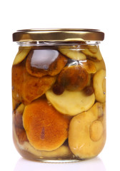 Glass jar of mushroom preserve isolated on white