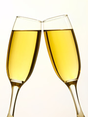 Two champagne glasses in toast