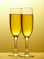 Two champagne glasses in toast