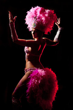 cabaret dancer over dark background