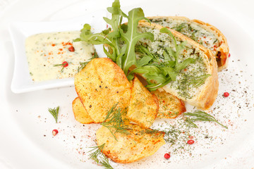 fish pie with sauce and potato chips