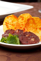 Black pudding sausage and potato chips