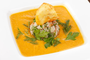 cream soup with rice and potato chips