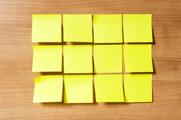 Fototapeta premium Many reminder notes on the wooden background