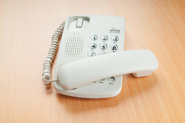 White office phone on the flat surface