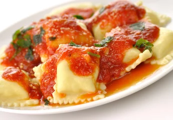 Foto op Canvas Ravioli pasta with red tomato sauce © SunnyS