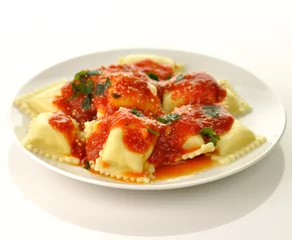 Deurstickers Ravioli pasta with red tomato sauce © SunnyS