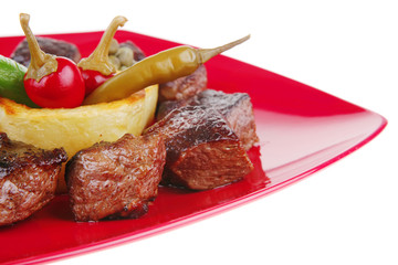grilled beef meat on red