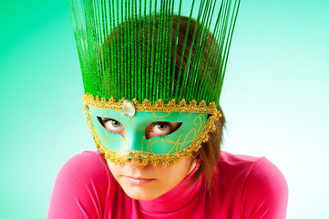 Attractive woman posing in the stylish mask