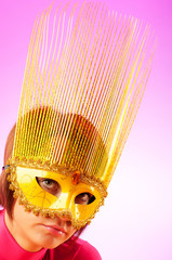 Attractive woman posing in the stylish mask