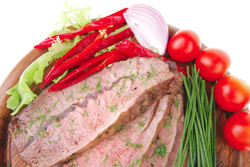 beef on plate over wood isolated