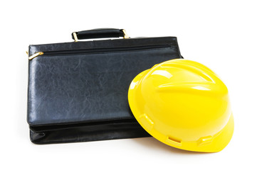 Construction concept - case and hard hat isolated on white