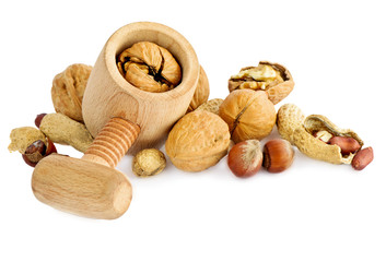 cracked walnut in nutcracker on white background