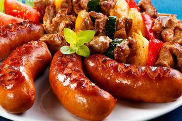 Grilled meat, sausages and vegetables