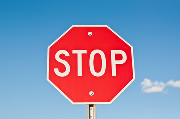 Stop Sign with Blue Sky and Clouds