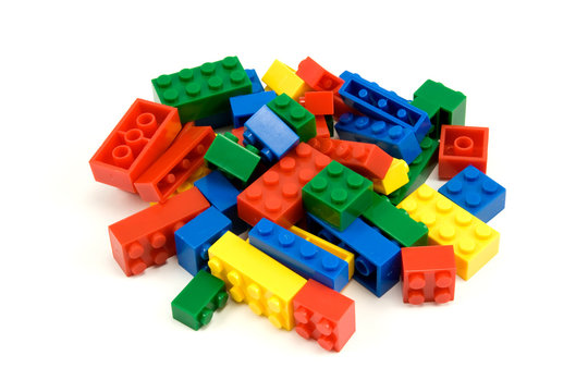 colorful plastic blocks over a white background