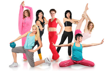 Obraz premium Smiling seven girls group in sportswear does gymnastic exercise