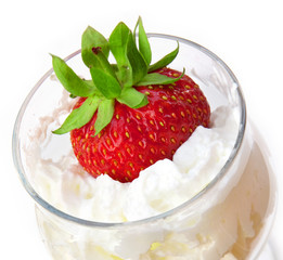 Strawberry in a glass with whipped cream