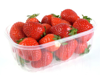 ripe strawberries in a plastic container