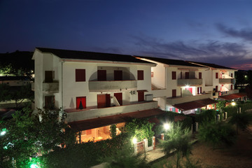 Fototapeta na wymiar building of sanatorium at night. three-storey villas