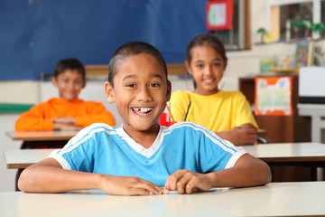 Cheerful primary school children in classroom