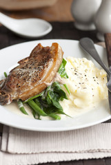 Pork chop with mashed potatoes and cider sauce