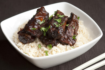 Mini spare ribs in a sticky hoisin sauce with rice
