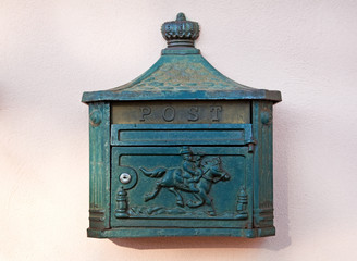 Old letterbox on pink wall