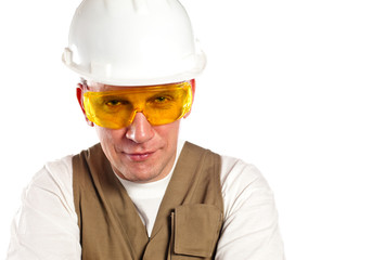 The man, the builder,in goggles and a helmet.