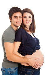 Fototapeta premium Mom and dad with hands on pregnant belly isolated on white