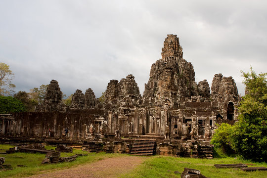 Gigantic Face Statues At Angkor Wat Ruins