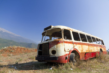 bus wreck in arid landscape