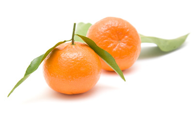 clementines with leaves, isolated on white background