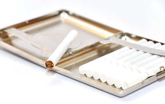Cigarettes in metal cigarette case.