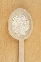 spoon with white rice - obrazy, fototapety, plakaty