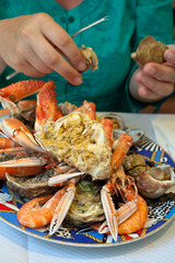 plate with cut crab and seafood
