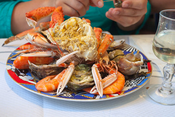 plate with cut crab and seafood