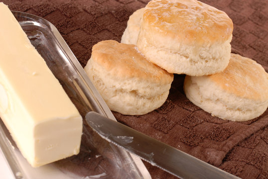 Homemade baked biscuits dripping with butter
